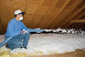 Installing blown-in cellulose insulation; photo courtesy Nancy Butler
